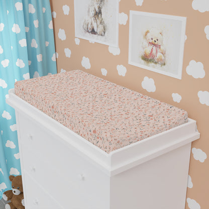 Ditsy Blooms changing pad cover fitted over a contoured pad
