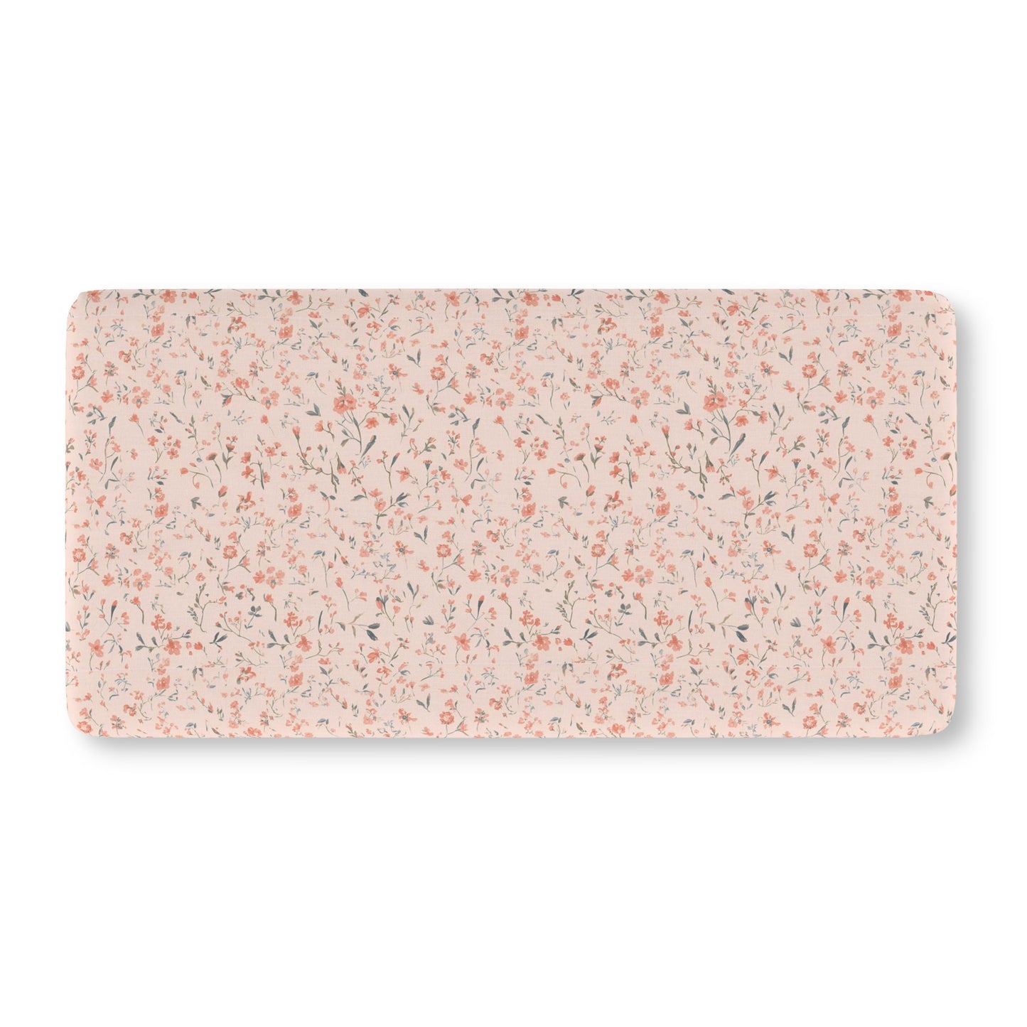 Fitted crib sheet with tiny coral flowers on blush