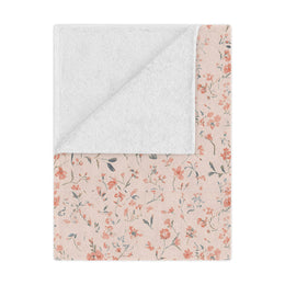 Ditsy Blooms minky baby blanket draped over a crib