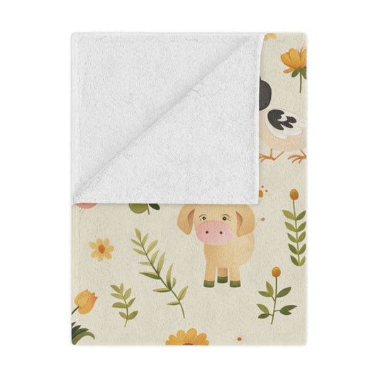 Farmyard Friends minky baby blanket draped over a crib