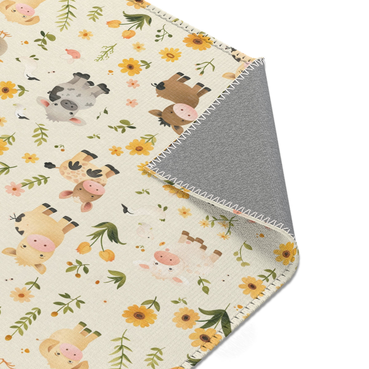 Sunflower and farm animal nursery rug under a crib