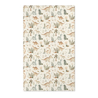 Dinosaur nursery area rug in sage and tan on cream