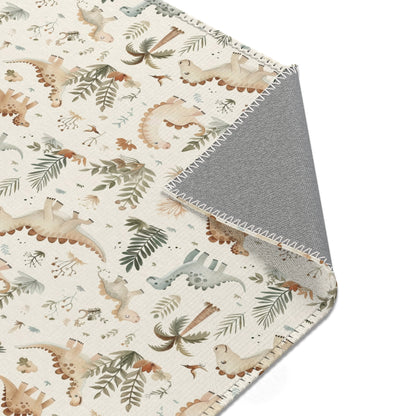 Nursery area rug printed edge to edge with dinosaurs and ferns
