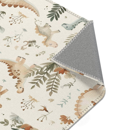 Dinosaur rug in sage and tan on cream for a nursery floor