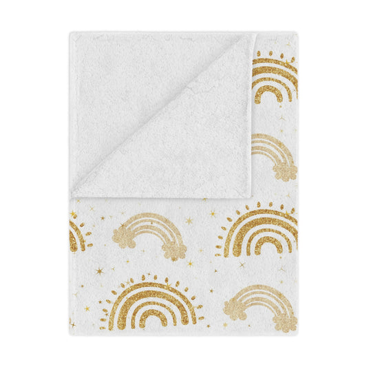 Golden Arches minky baby blanket draped over a crib