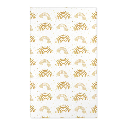 Gold rainbow nursery area rug on a white ground