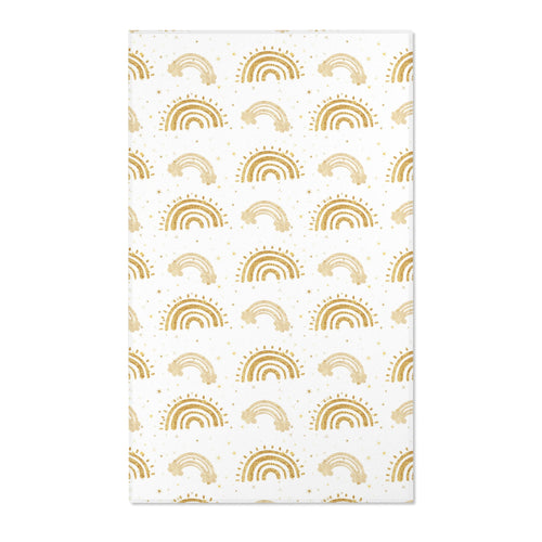 Gold rainbow nursery area rug on a white ground