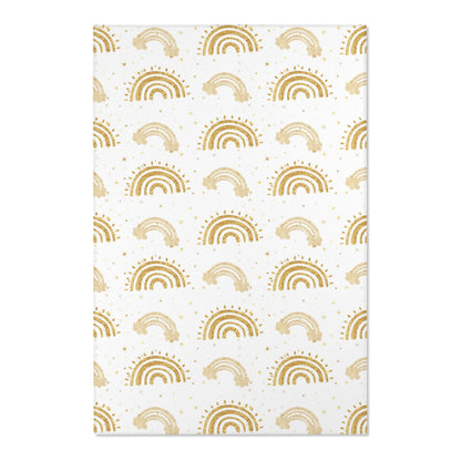 Close detail of the gold arches on the nursery area rug