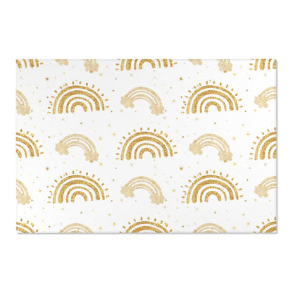 Low pile nursery rug with gold rainbow arches and stars