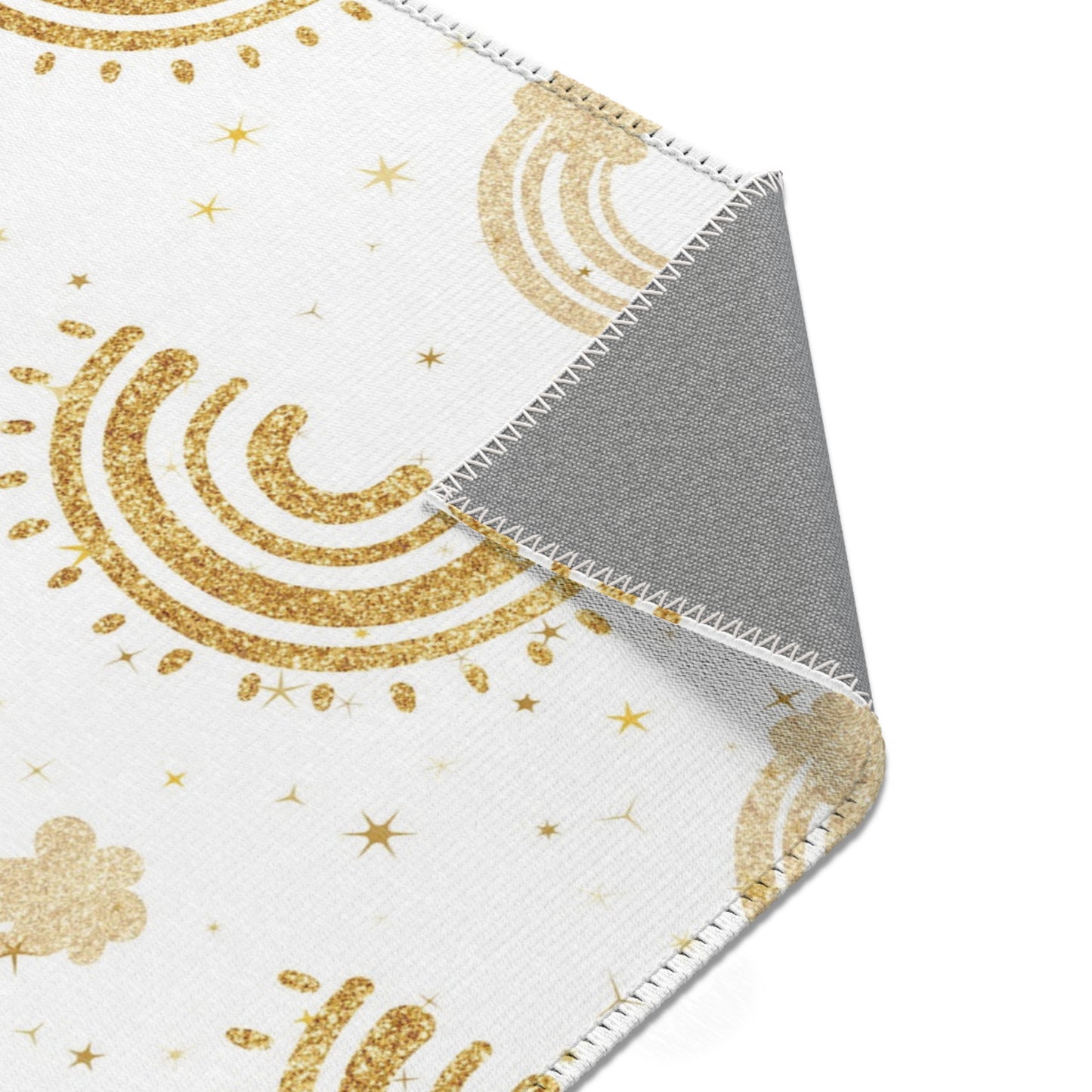 Gold rainbow rug on white for a nursery floor