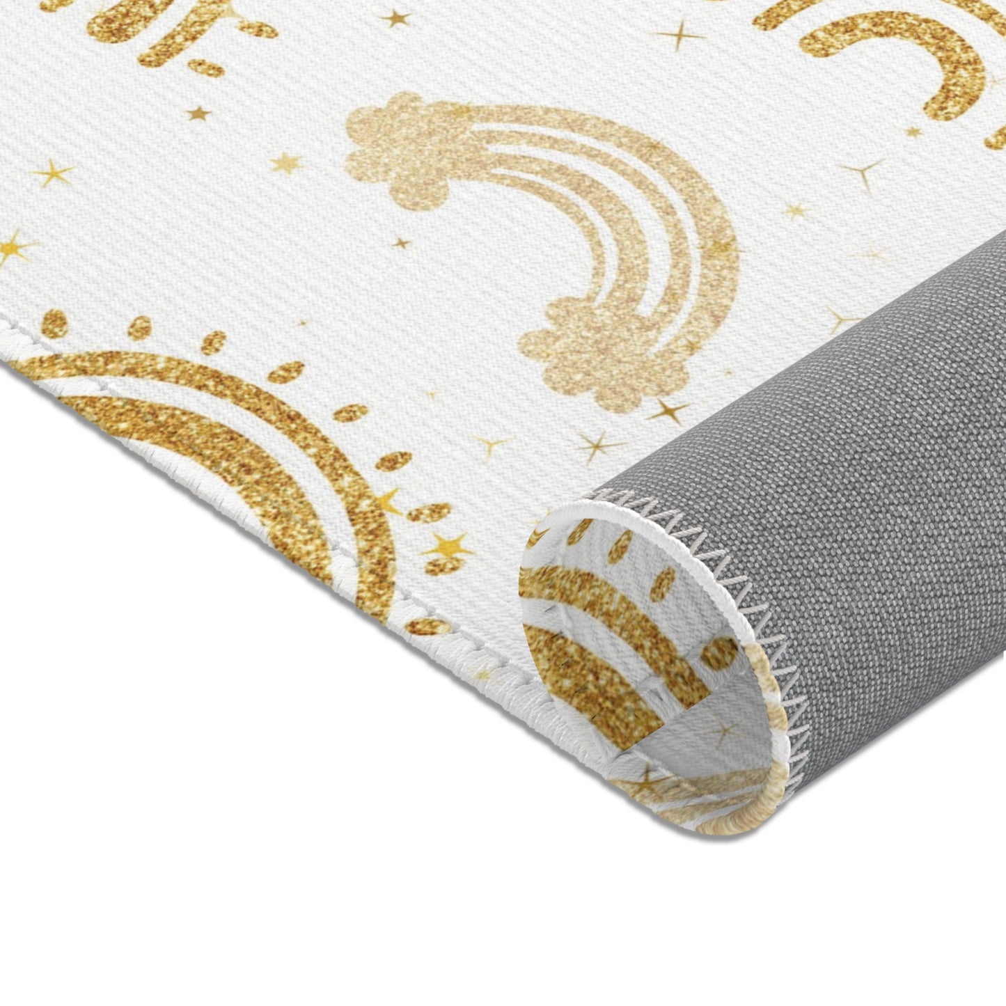 Gold arches and small clouds printed across the nursery area rug
