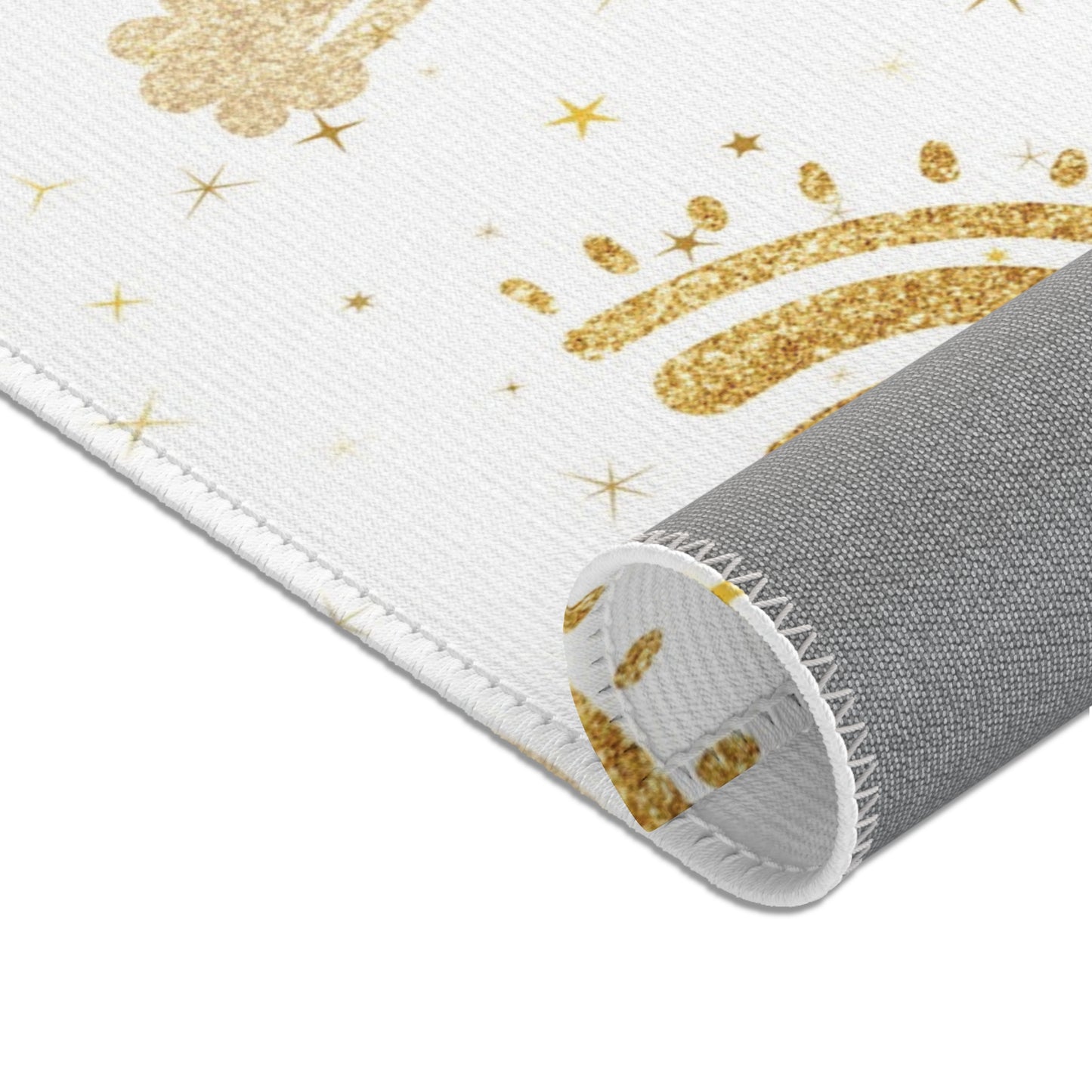 Nursery area rug in a warm gold and white palette