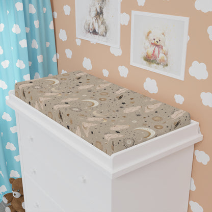 Golden Cosmos changing pad cover fitted over a contoured pad