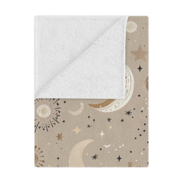 Golden Cosmos minky baby blanket draped over a crib