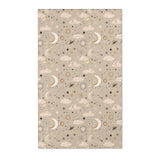Celestial nursery area rug in gold and cream on warm taupe
