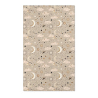 Celestial nursery area rug in gold and cream on warm taupe