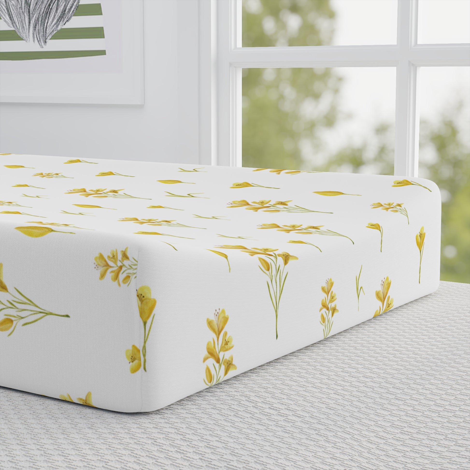 Golden Meadow pad cover matching the nursery crib sheet
