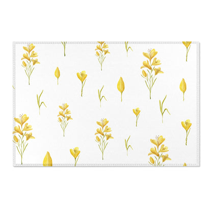 Yellow freesia print area rug beside a nursery crib