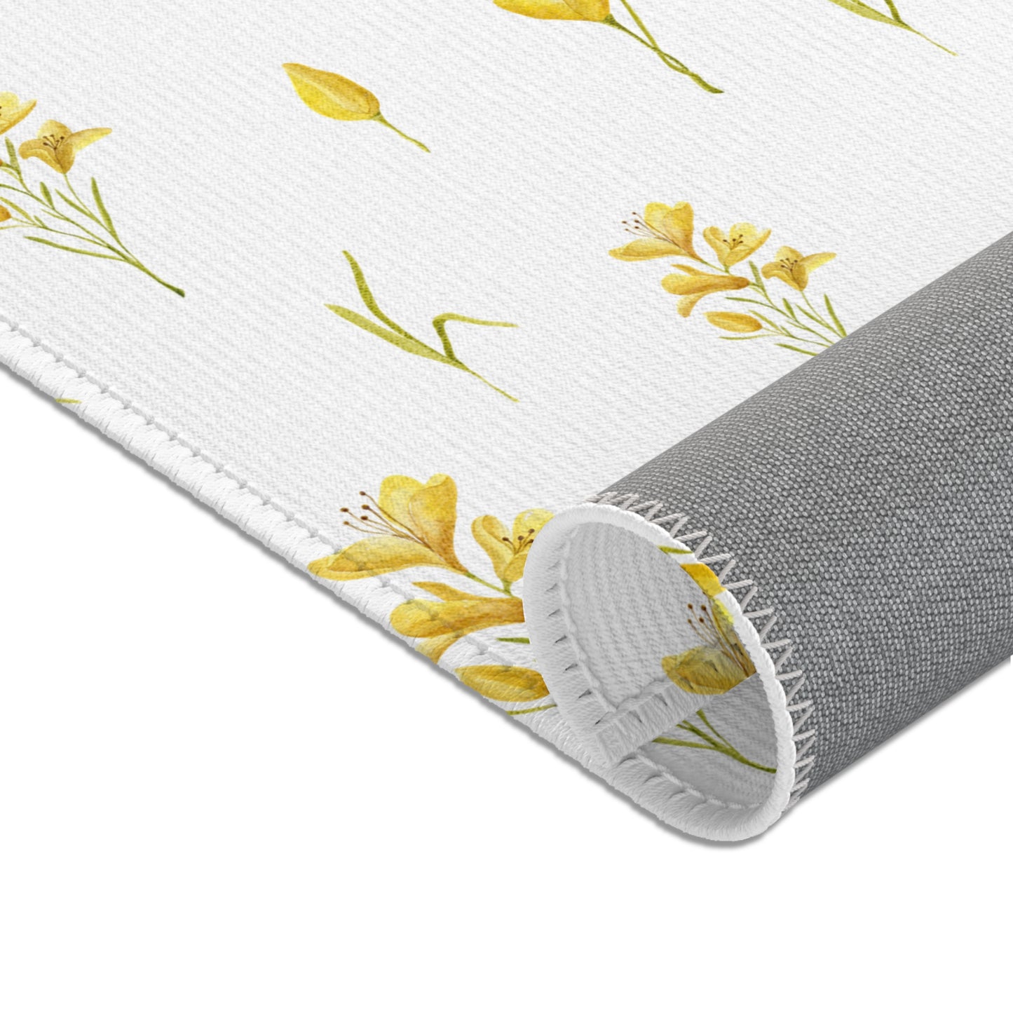 Yellow floral nursery rug under a crib