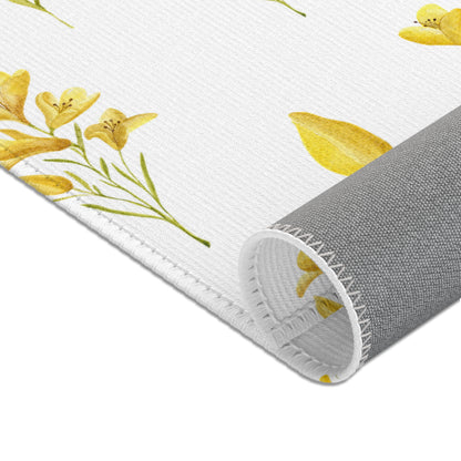Mustard yellow rug beside a nursery glider chair
