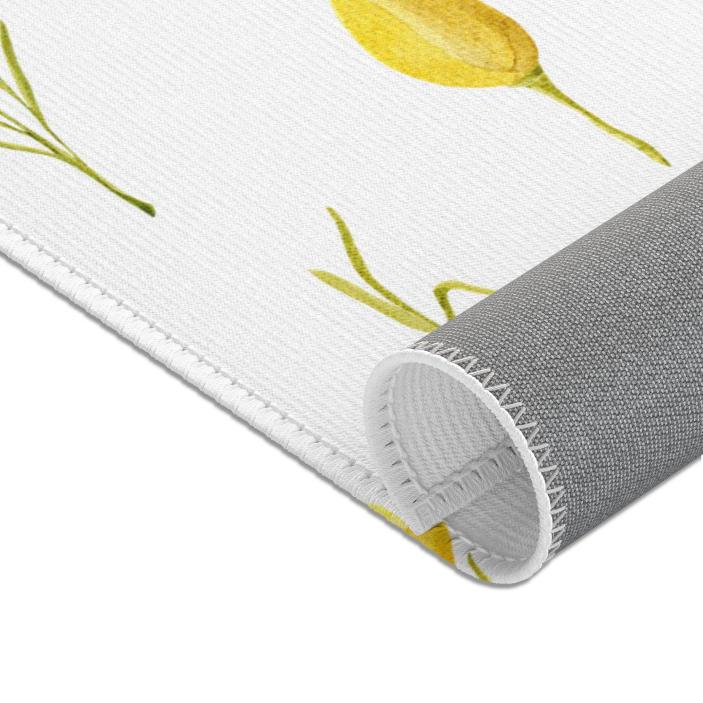 Yellow floral area rug in a baby nursery corner