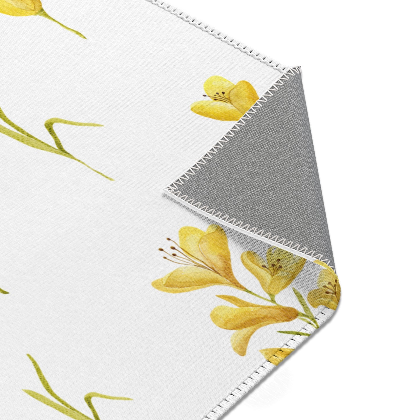 Mustard freesia print rug in a small baby room