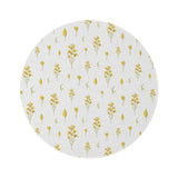 Golden Meadow round nursery rug on a baby room floor