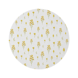 Golden Meadow round nursery rug on a baby room floor
