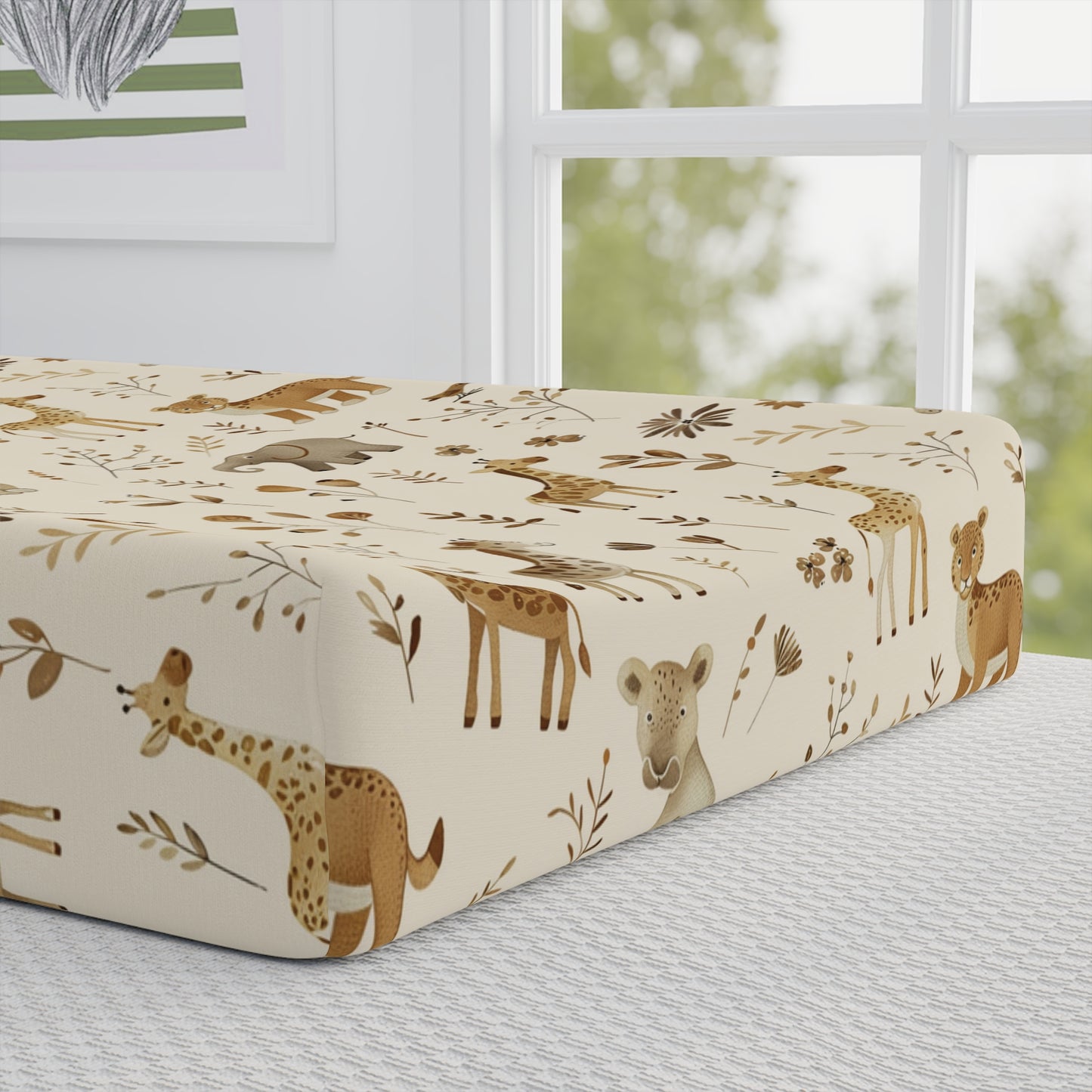 Close detail of the Golden Savanna print on the changing pad cover