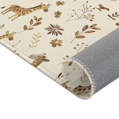 Giraffes and dried grasses printed across the nursery area rug