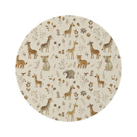 Golden Savanna round nursery rug on a baby room floor