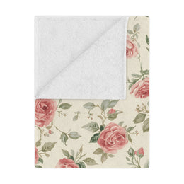 Heirloom Roses minky baby blanket draped over a crib