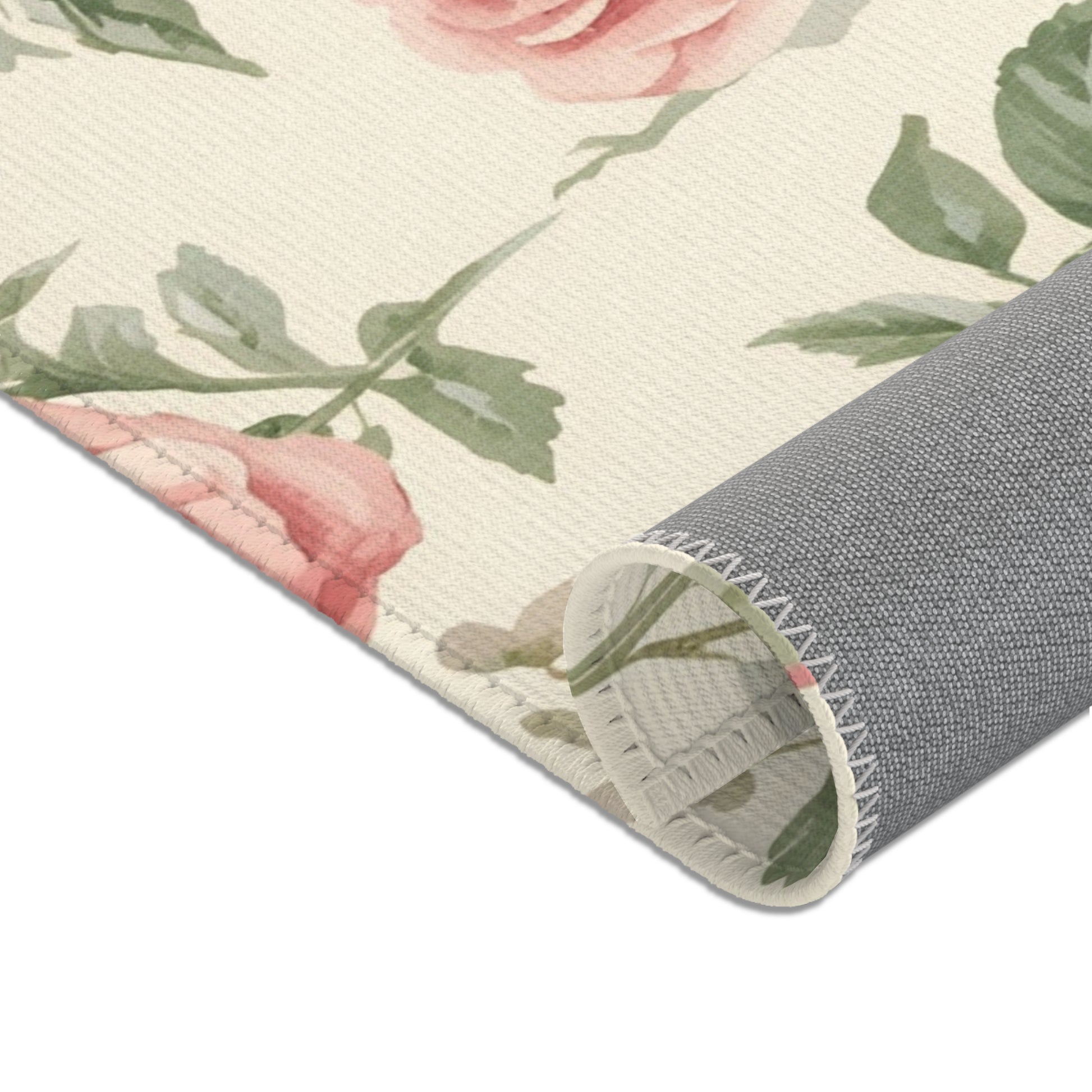 Nursery area rug in a dusty pink, sage and cream palette