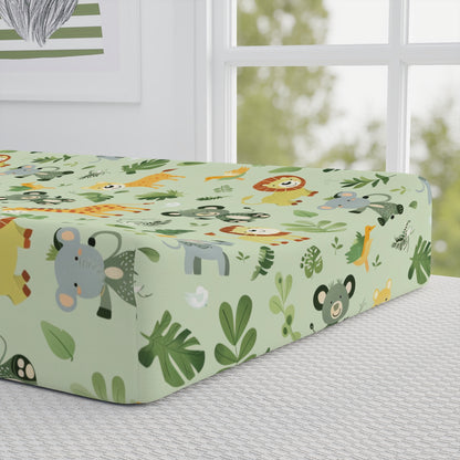 Close-up of the jungle print on a nursery changing pad cover