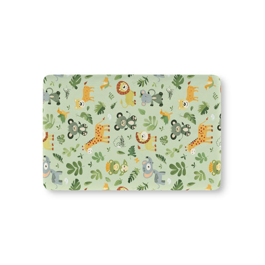 Jungle animal fitted crib sheet on a nursery crib mattress
