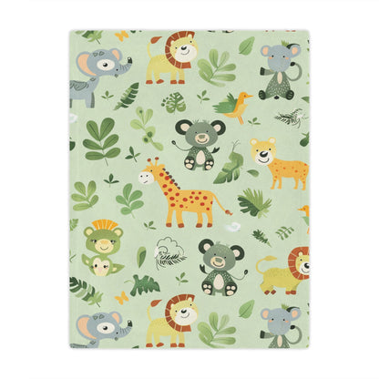 Jungle animal minky baby blanket draped over a crib