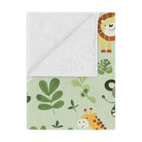 Close-up of the plush minky texture on a jungle baby blanket