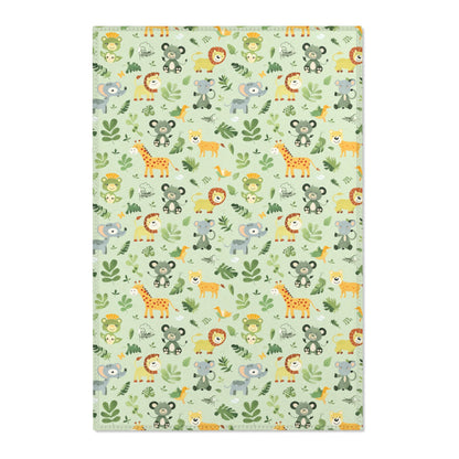 Jungle animal nursery area rug in a sage green baby room