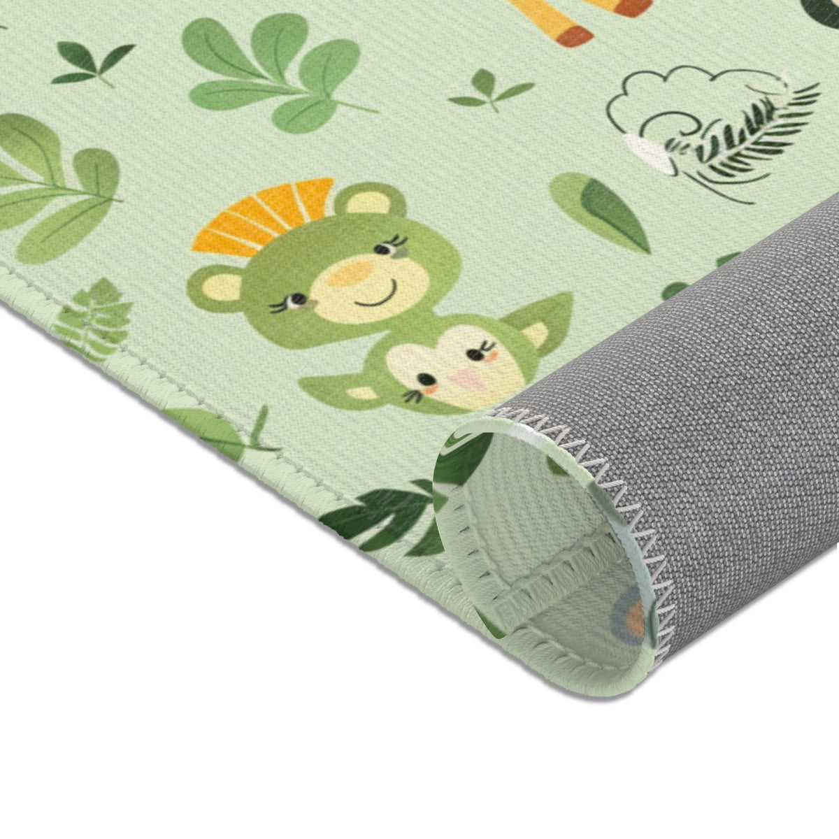 Sage green jungle area rug in a baby nursery corner