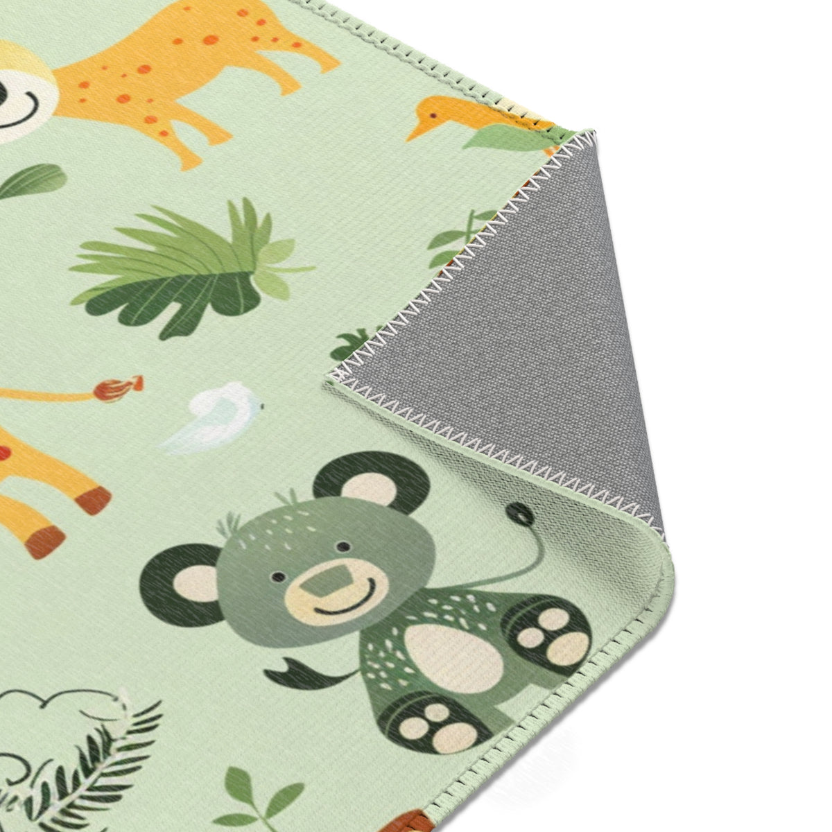Jungle animal rug seen from above in a nursery