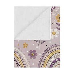 Lilac Meadow Arches minky baby blanket draped over a crib