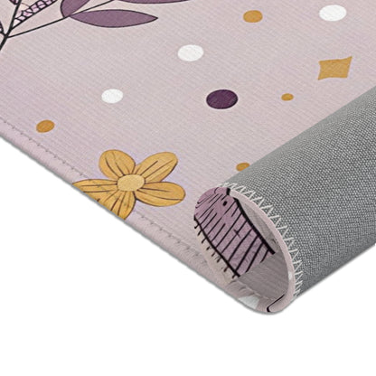 Nursery area rug in a lilac, plum and mustard palette
