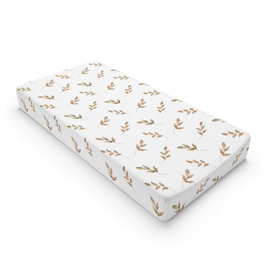 Linen Leaf changing pad cover on a nursery changing table