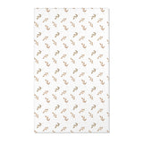 Neutral botanical nursery area rug in taupe and tan on white