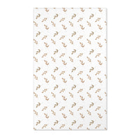 Neutral botanical nursery area rug in taupe and tan on white