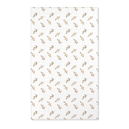 Neutral botanical nursery area rug in taupe and tan on white