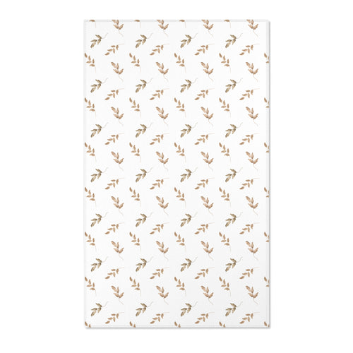 Neutral botanical nursery area rug in taupe and tan on white
