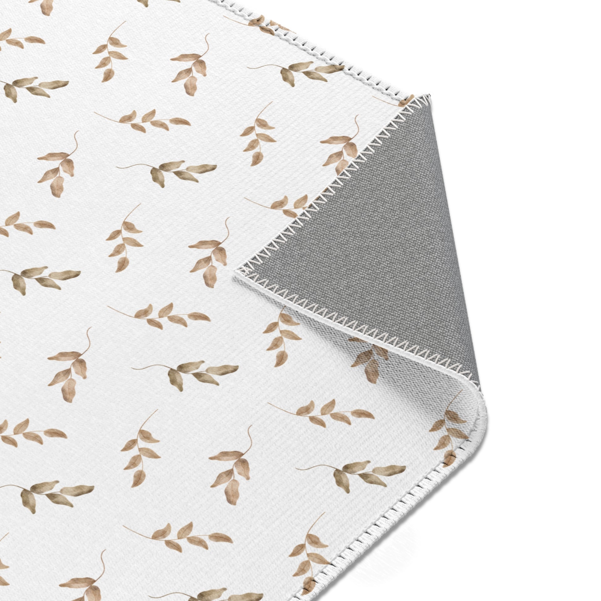 Nursery area rug printed edge to edge with leaf sprigs