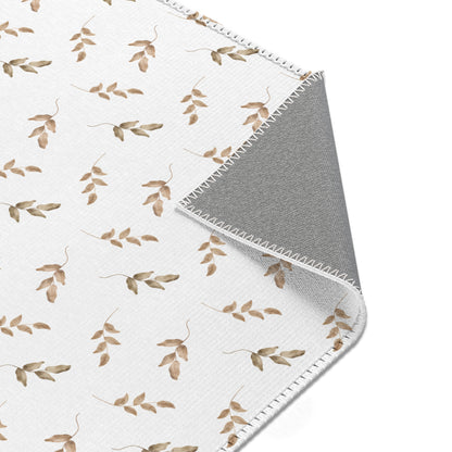 Nursery area rug printed edge to edge with leaf sprigs