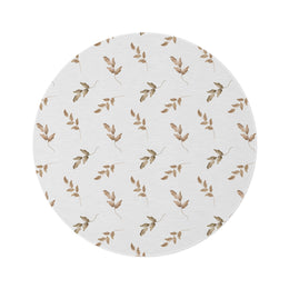 Linen Leaf round nursery rug on a baby room floor